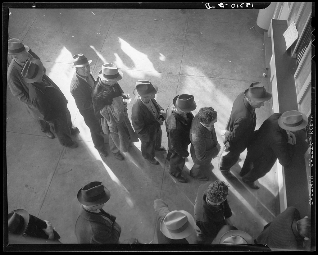 Men form a line inside a San Francisco state employment office in 1938.