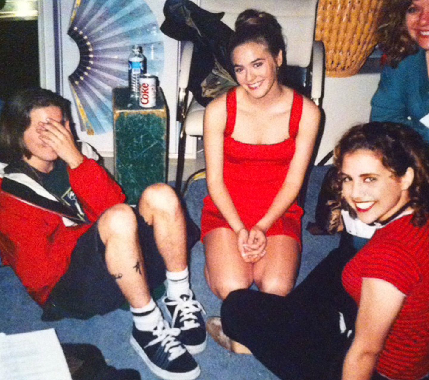 Breckin Meyer, Alicia Silverstone, and Brittany Murphy sit together in costume between takes during the filming of Clueless.