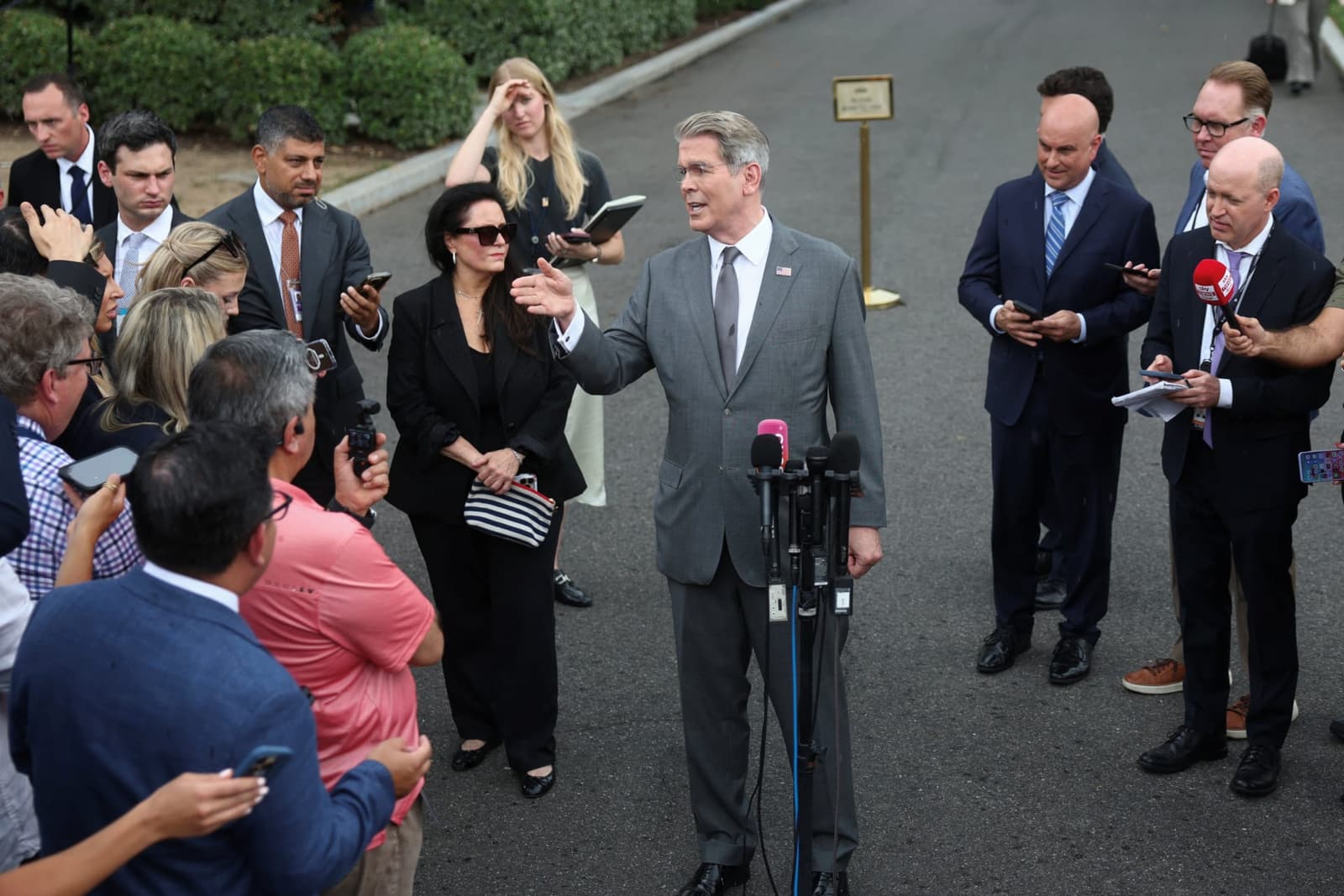 U.S. Treasury Secretary Scott Bessent speaks to a group of reporters outside the White House.
