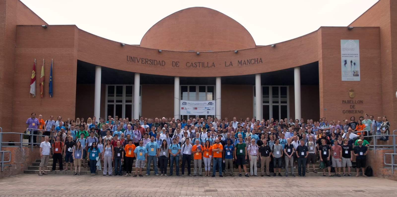 Hundreds of useR! 2013 attendees pose on the steps of the University of Castilla-La Mancha in Albacete, Spain.