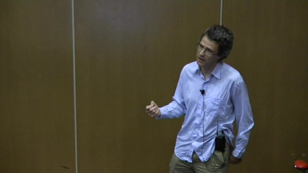 Robert O'Callahan gestures while presenting the rr record-and-replay debugger at linux.conf.au 2016 in Geelong.