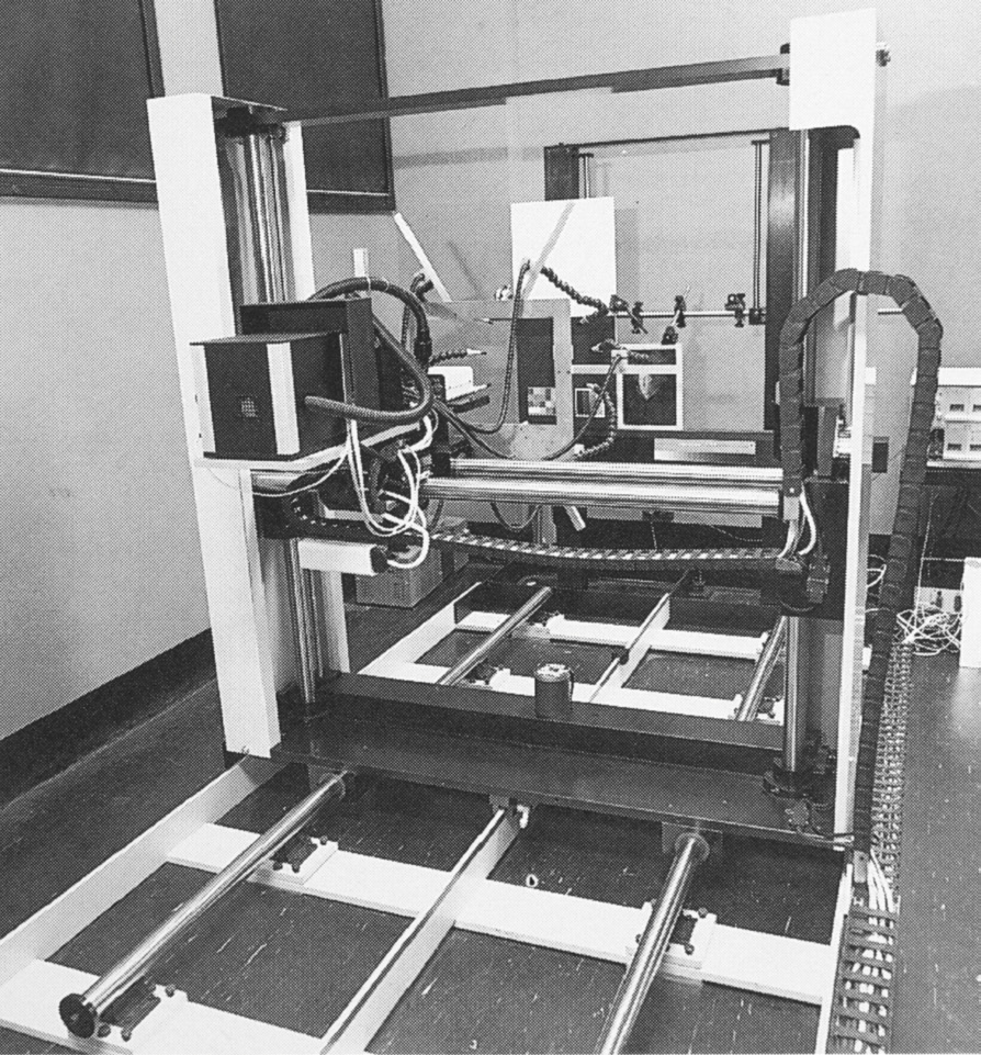 Archival black-and-white photograph of the VASARI camera-positioning gantry, rails, lighting equipment, and cables at the National Gallery.