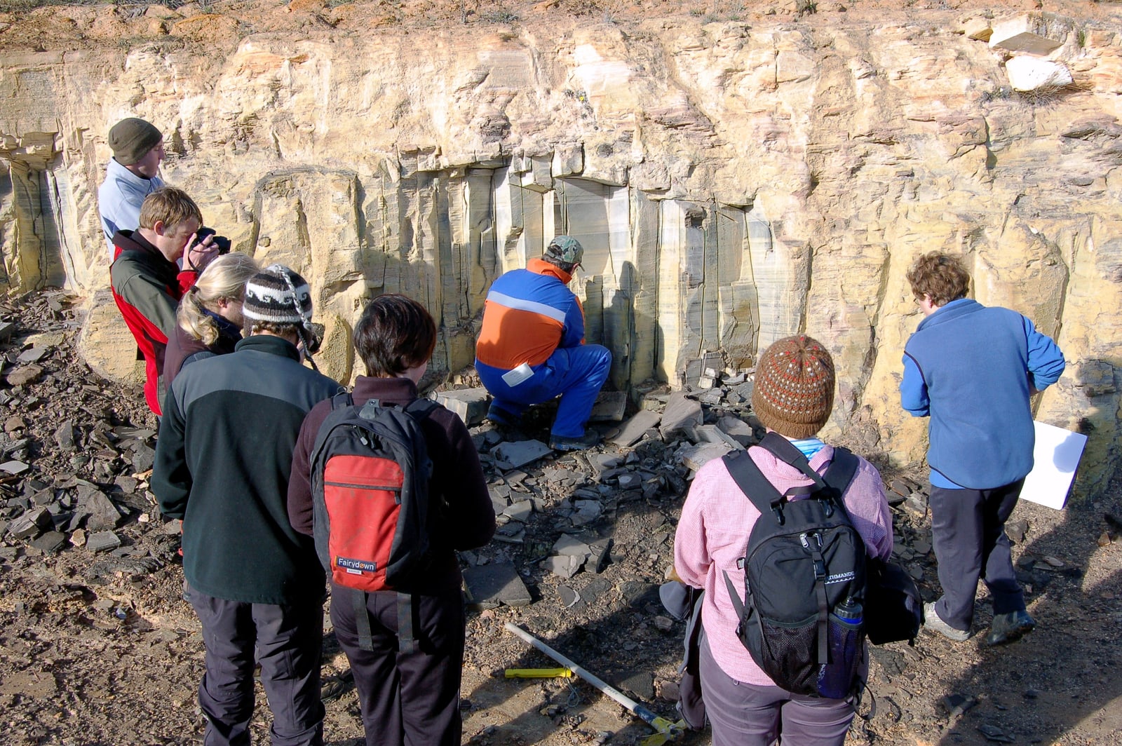 University of Otago students examining the pale diatomite exposure at Foulden Maar, New Zealand.