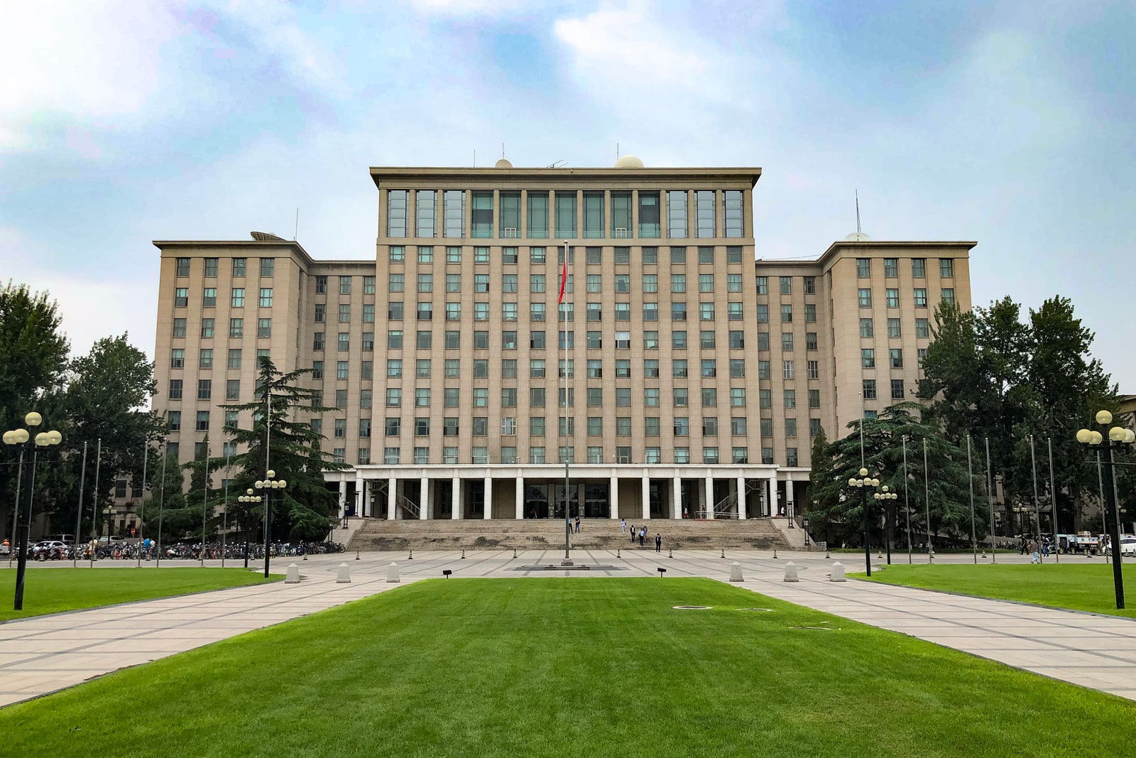 Tsinghua University's main building viewed across its tree-lined grounds.