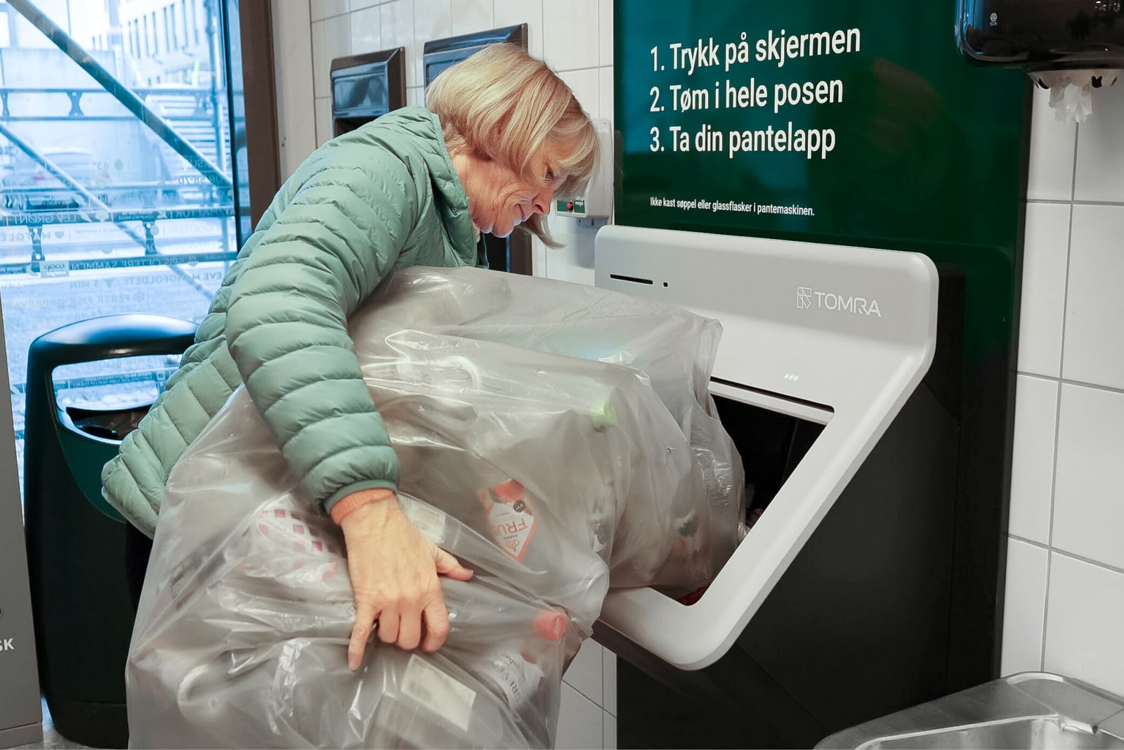 A customer uses a TOMRA R2 bottle-return machine inside Coop Mega Lillehammer in Norway.