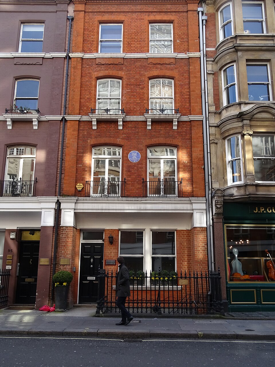 The exterior of 97 Mortimer Street in London, with a blue plaque commemorating Hector Hugh Munro, known as Saki.