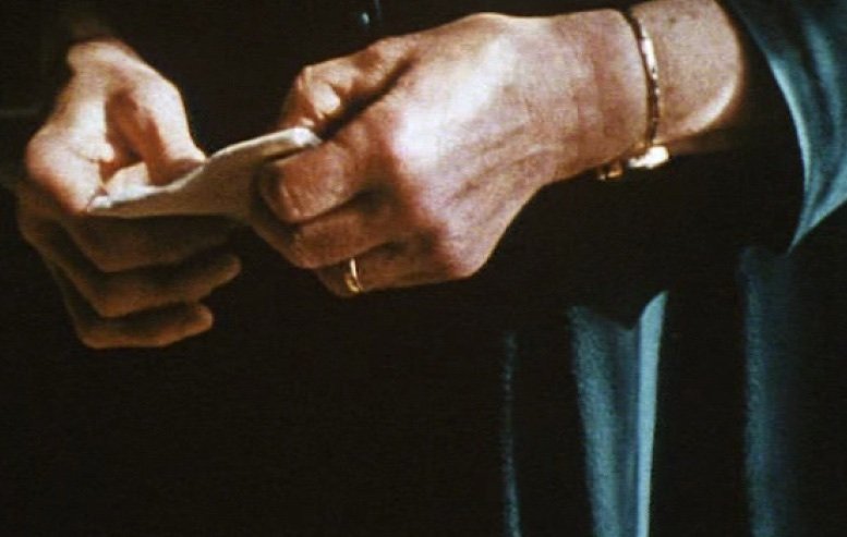 Close-up of the filmmaker’s mother’s hands in A Portrait of Ga, against the fabric of her dress.