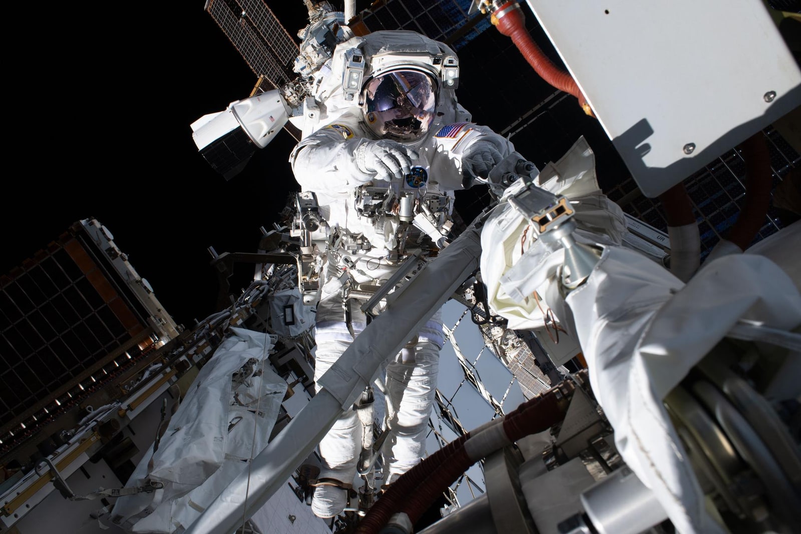 NASA astronaut Anil Menon works outside the International Space Station during preparations for solar-array upgrades.