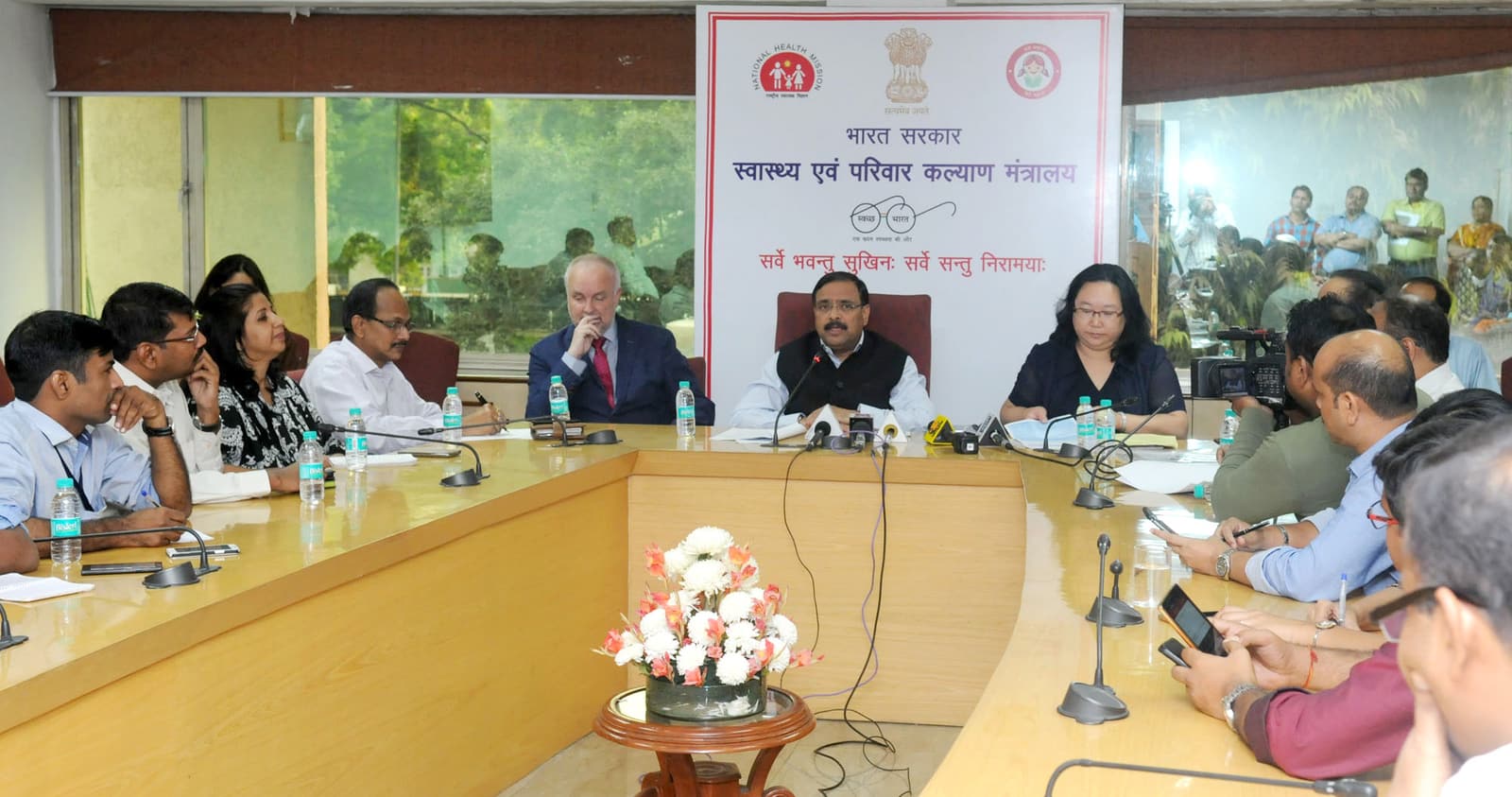 Officials seated behind microphones at a 2016 press conference for the seventh Conference of the Parties to the WHO Framework Convention on Tobacco Control in New Delhi.