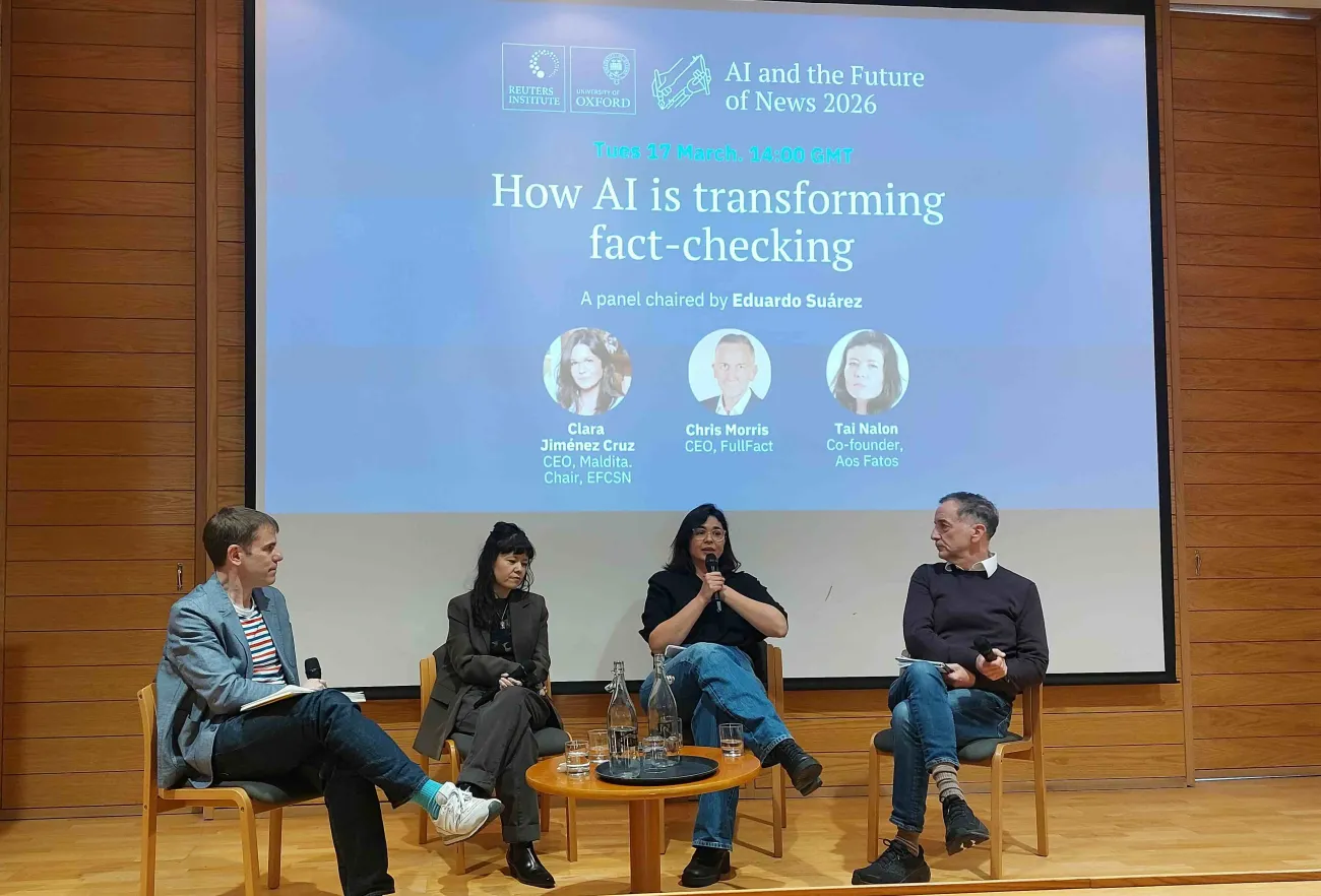 Journalists and fact-checking leaders sit on a Reuters Institute stage during an AI and the Future of News 2026 panel.